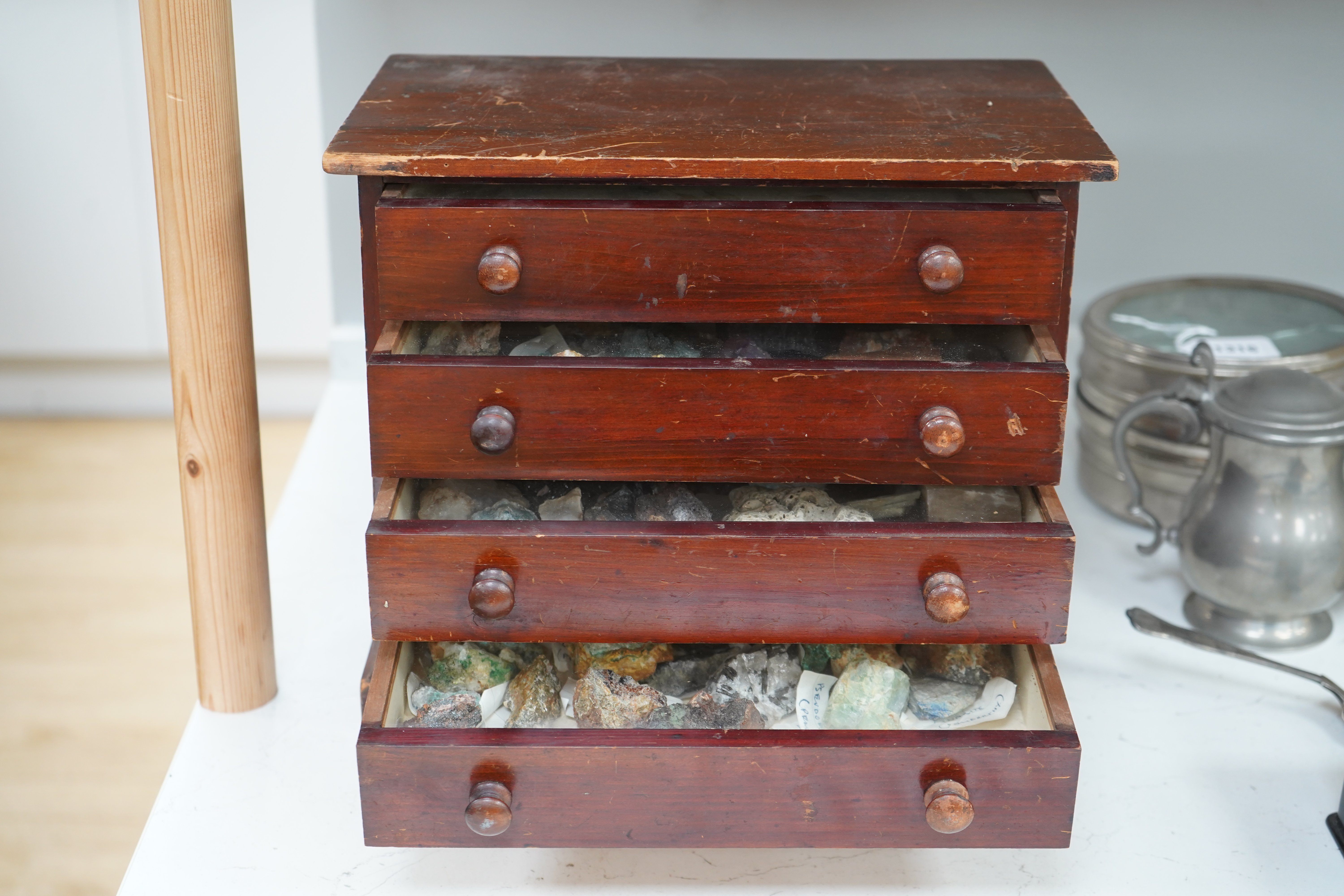 An early 20th century collector’s chest fitted with four drawers filled with mineral specimens and butterflies to include Haematite, Scorodite and Pyrite, 30cm high. Condition - fair